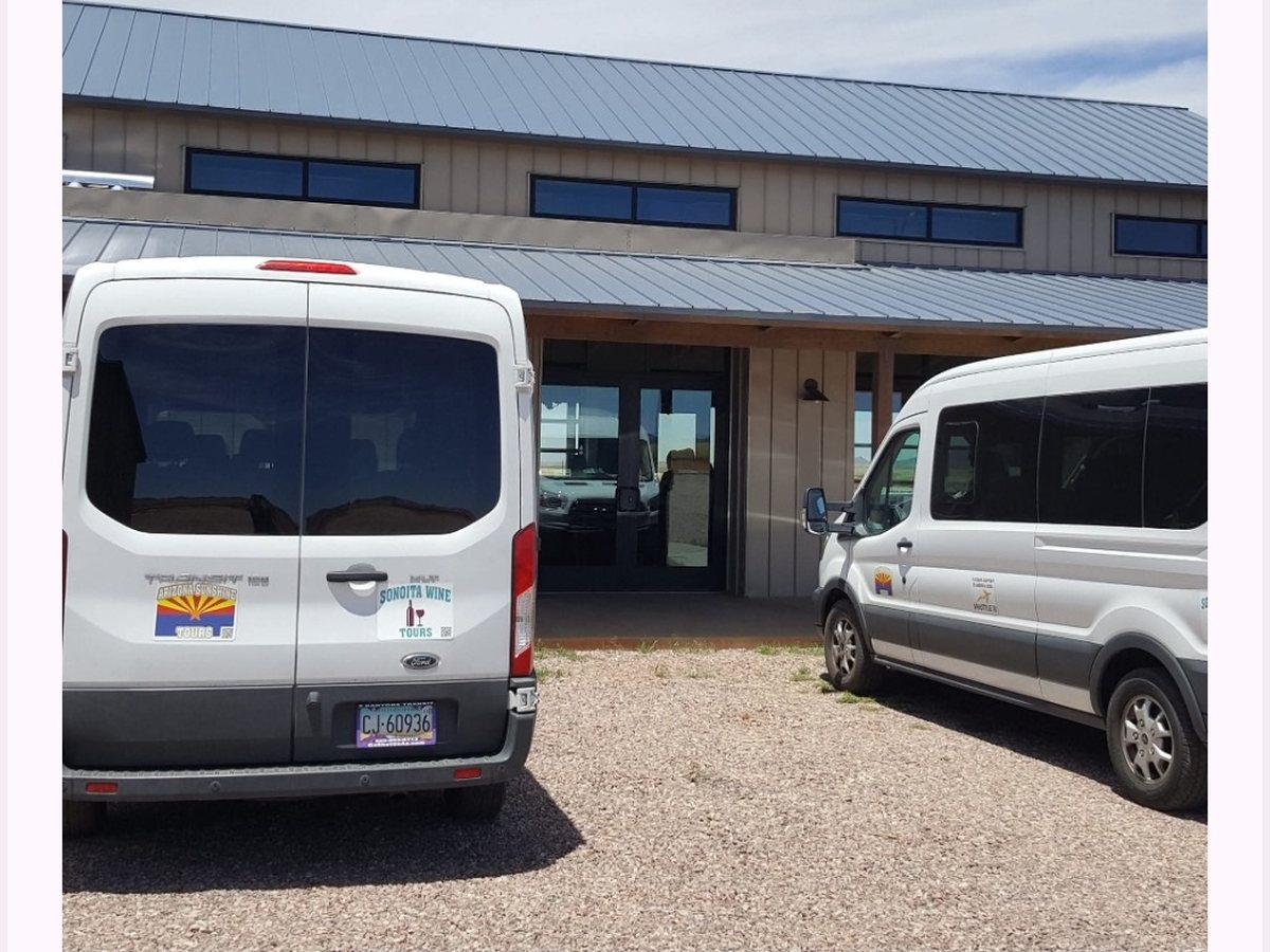 Sonoita Wine Tours vans parked outside a winery
