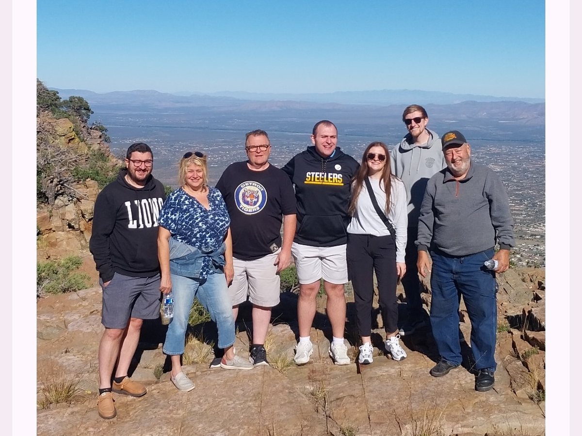 A group photo overlooking Southern Arizona on a Sonoita Wine Tours excursion