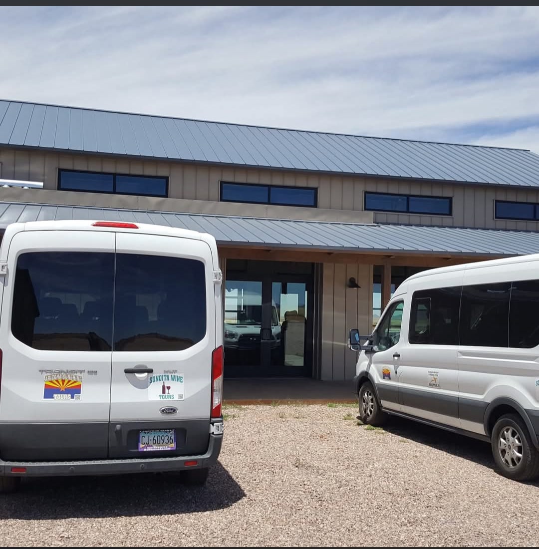 Sonoita Wine Tours vans parked outside a Sonoita winery